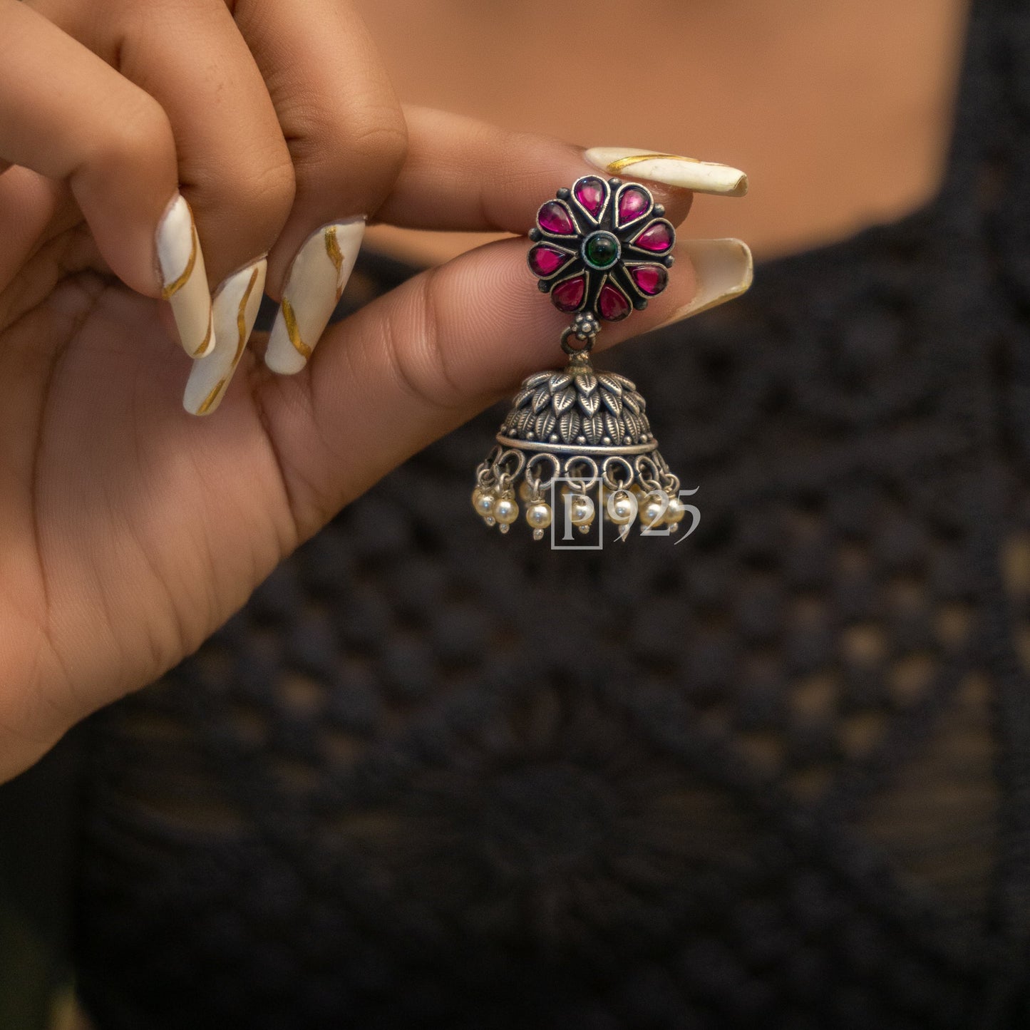 P925 Light Weight Temple Silver Jhumkas With Emerald Studs.